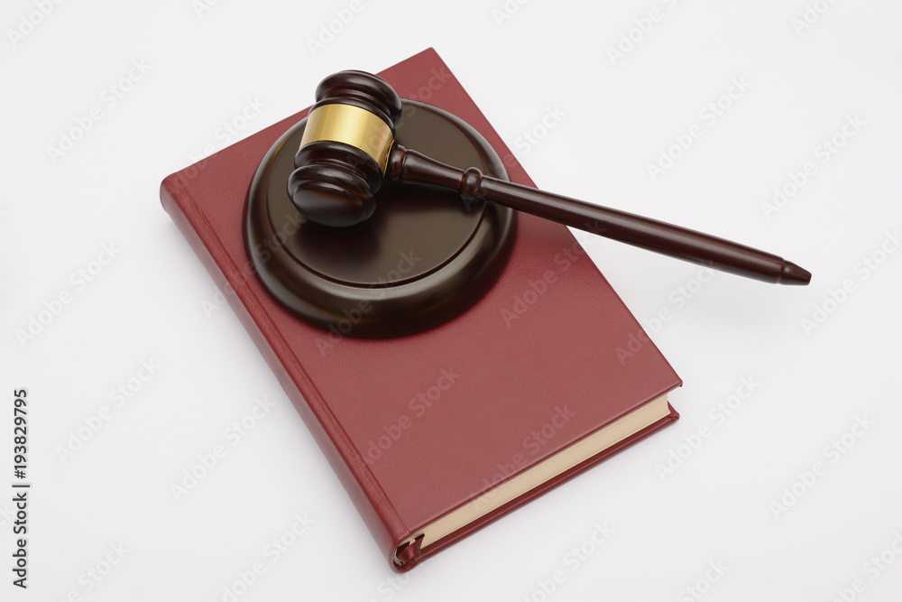 Wooden Gavel and lawp book on white background