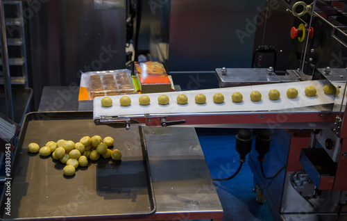 Dough divider and rounder machine. Food and bakery industry production line	