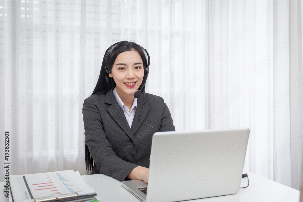 Young woman call center operator working in office. Service desk consultant talking Young woman call center operator working in office. Service desk consultant talking