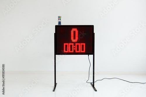 Red led light illumination numbers on black digital electric display isolated on white background photo