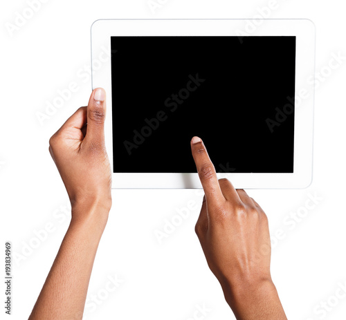 Holding and pointing to blank screen on tablet