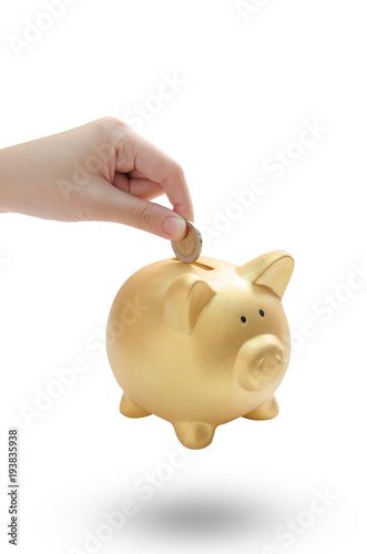 woman hand dropping a coin into a piggy bank on white background