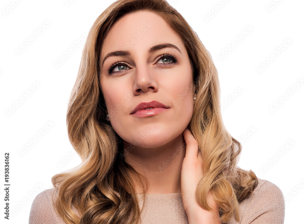 Attractive cute blonde. Close-up portrait on a white. Beautiful young woman in a flesh-colored dress. Attractive cute blonde. Close-up portrait on a white. Beautiful young woman in a flesh-colored dress.