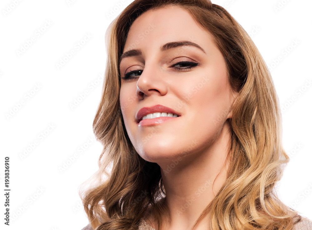 Attractive cute blonde. Close-up portrait on a white. Beautiful young woman in a flesh-colored dress. Attractive cute blonde. Close-up portrait on a white. Beautiful young woman in a flesh-colored dress.