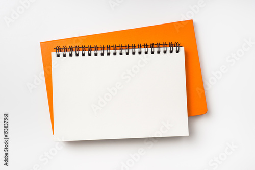 Business concept - Top view collection of two notebook ( kraft spiral and orange hardcover ) isolated on background for mockup