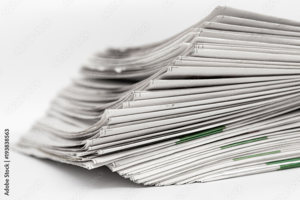 Newspapers on a white background.