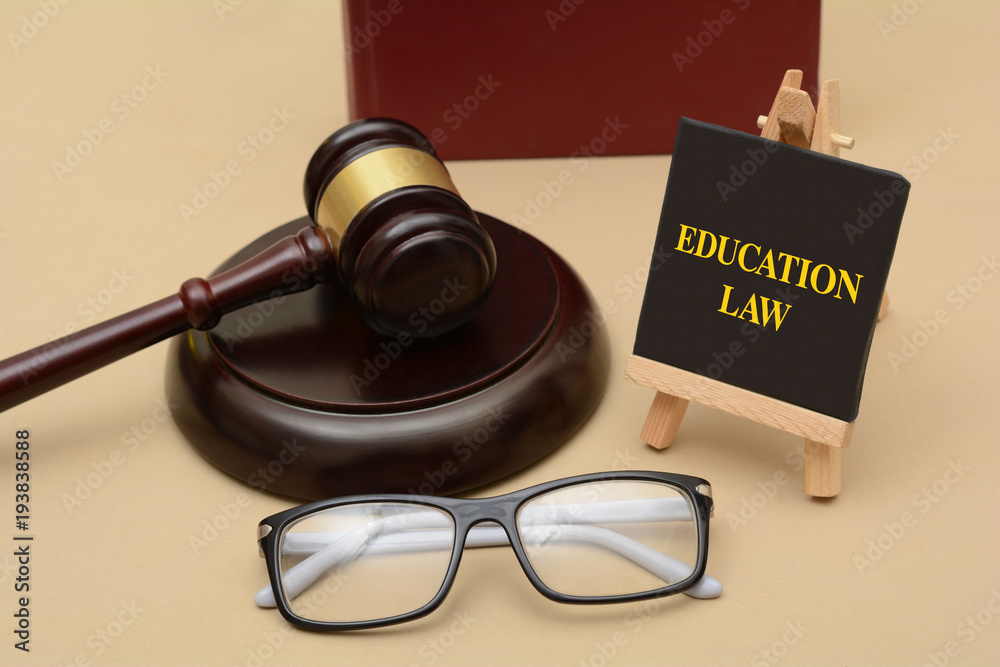 Education Law sign with wood gavel and glasses