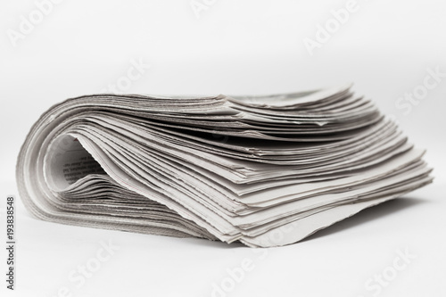 Newspapers on a white background.