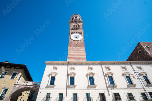 Torre dei Lamberti, the clock tower in Piazza delle Erbe. Verona, Italy photo