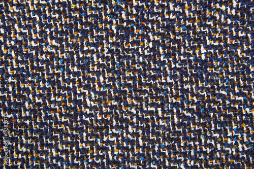Varicolored tweed like texture, varicolored wool pattern, textured  melange upholstery fabric background copy space.