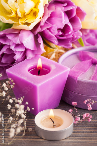 Purple yellow tulip flower, lit candles