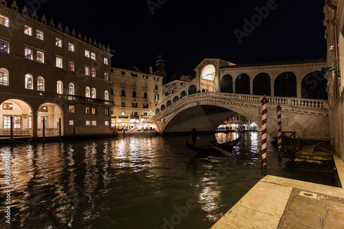 Night view of the Canal Grande with illuminated houses and Rialto Bridge, Venice, Italy © Gianluca