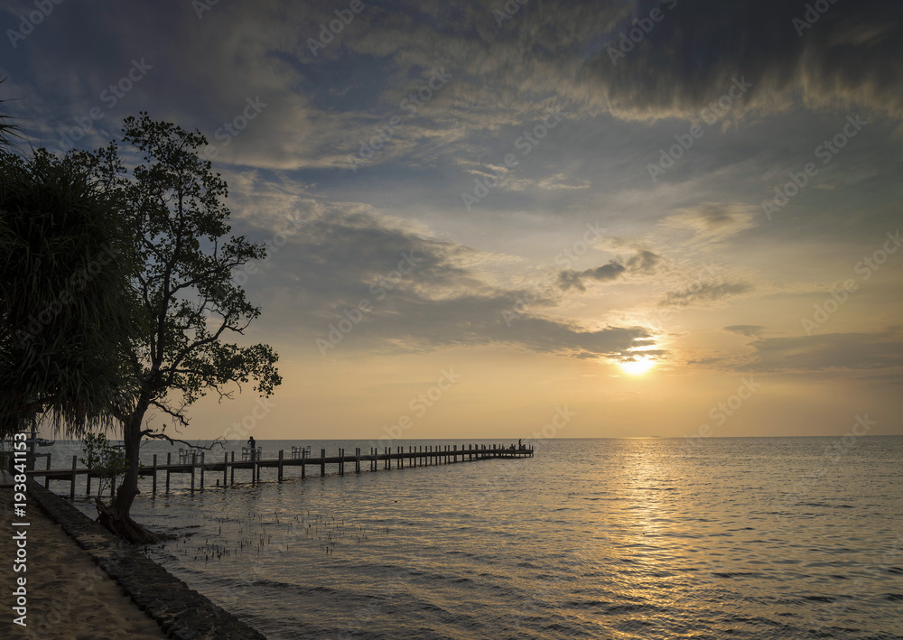 sunset and pier in kep on cambodia coast