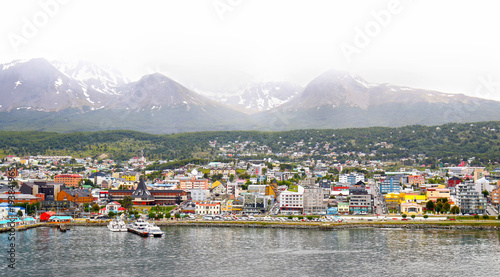 Scenic view of Colourful Town of Ushuaia in the mist. Capital of Tierra del Fuego province in Argentina, Patagonia,  South America photo