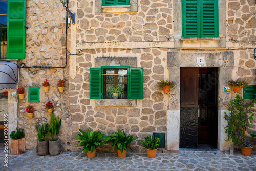 Beautiful street in Valldemossa with traditional flower decoration, famous old mediterranean village of Majorca. Balearic island Mallorca, Spain photo