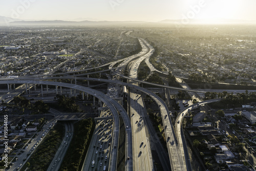 Aerial sunrise view of 105 and 110 freeway interchange ramps in Los Angeles California.