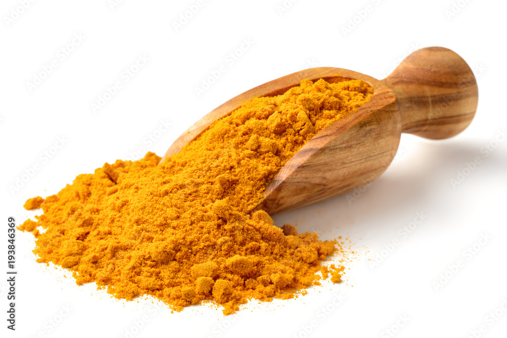 Turmeric powder in the wooden scoop, isolated on white - obrazy, fototapety, plakaty 