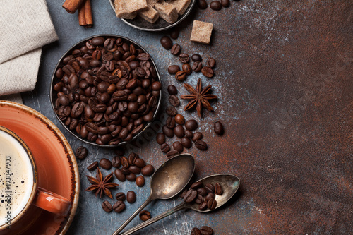 Coffee cup, beans, sugar and spices