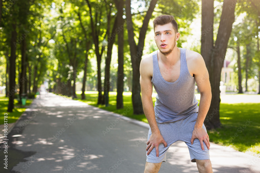 Tired man runner breathing, taking run break Tired man runner breathing, taking run break