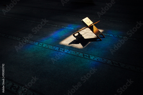 Quran - holy book of muslims, scene in the mosque at Ramadan time