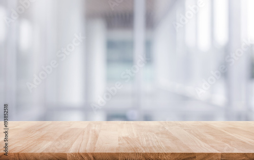 Wood table top on white abstract background form office building. © hakinmhan
