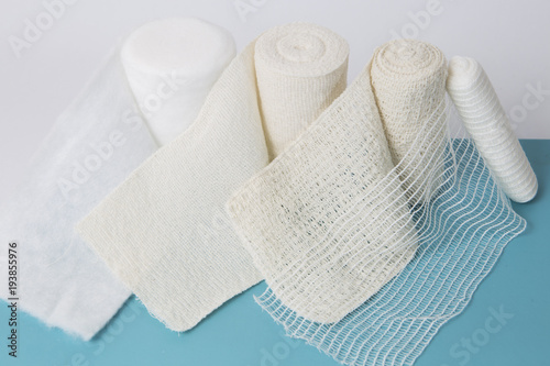 Photo isolated all different kinds of bandages standing on the blue table