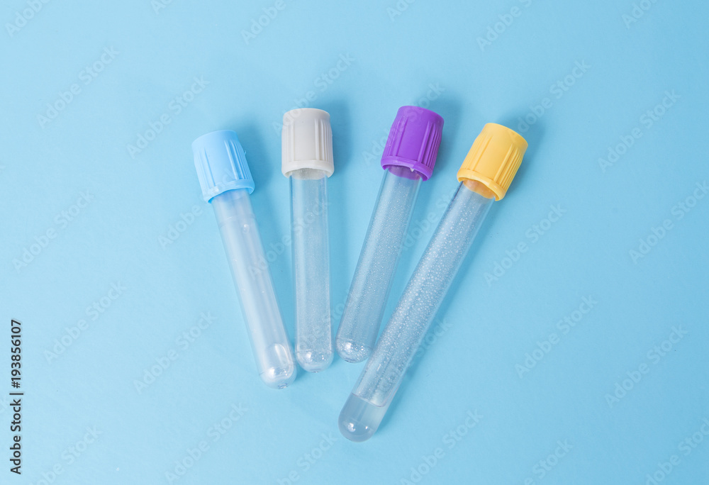 isolated different kinds of blood testing tubes lying at the blue background isolated different kinds of blood testing tubes lying at the blue background