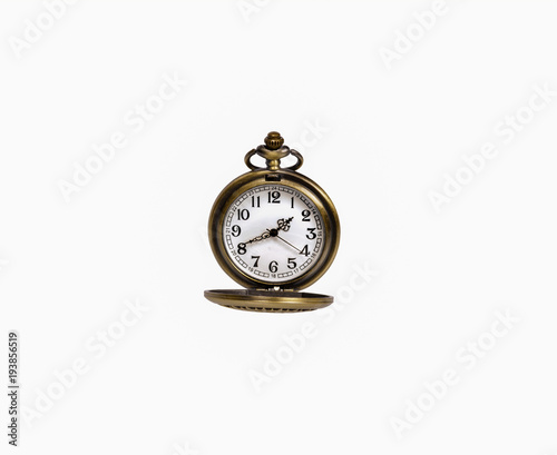 A vintage pocket watch on a white background close-up. There is a way.