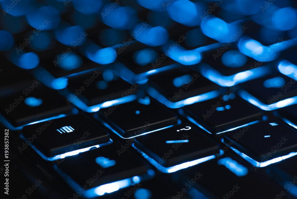 Illuminated keyboard closeup. Hi tech concept