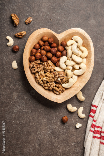 Assorted nuts in heart shaped bowl