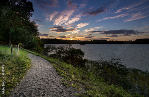 path beside a lake at sunset