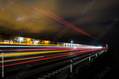 light trails after a truck driving on a bridge