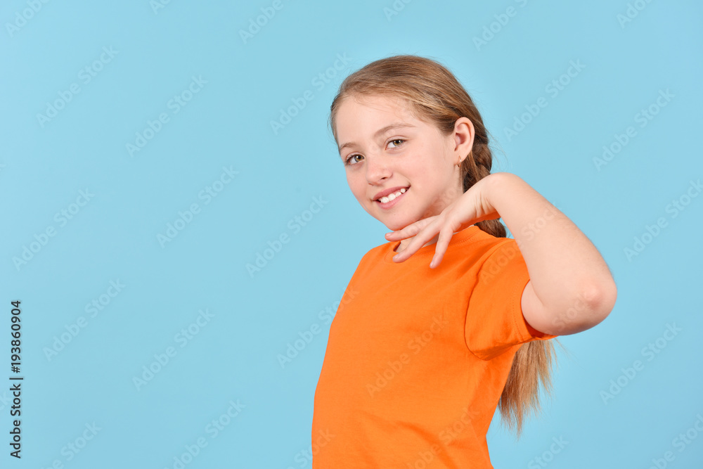 Happy girl on a blue background. Portrait of a teenager. Happy girl on a blue background. Portrait of a teenager.
