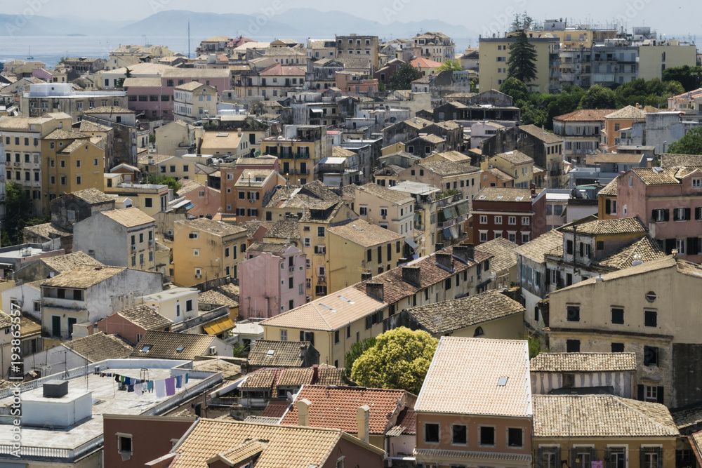 View on Corfu city or Kerkyra from New Fortress. Skyline of typical houses of old town. Tourist attraction and popular vacation destination. Sunny day in beginning of June.  arkhitiektura zodchiestvo 