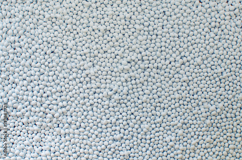 Polymer additive in granules, background texture
