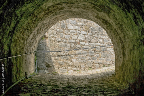 Fototapeta Naklejka Na Ścianę i Meble -  Arch in medieval fortress stone wall at Corfu , Greece.