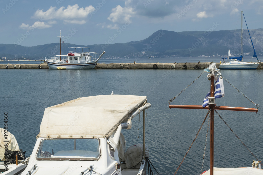 Harbor and bay with fishing boats and yachts at Corfu, Greece Harbor and bay with fishing boats and yachts at Corfu, Greece