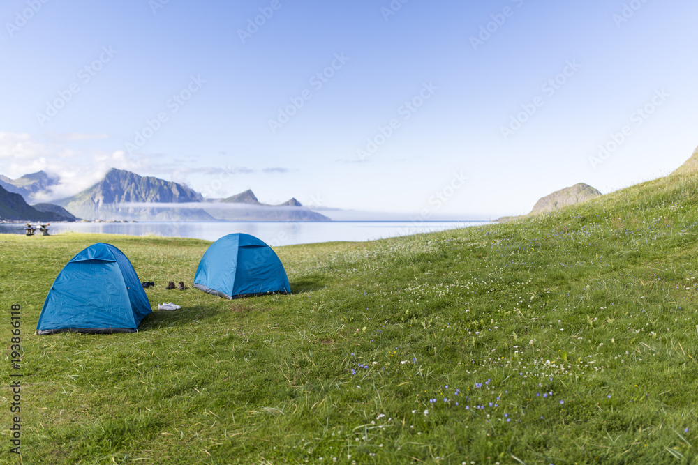 Two Blue Tents at the Beach.