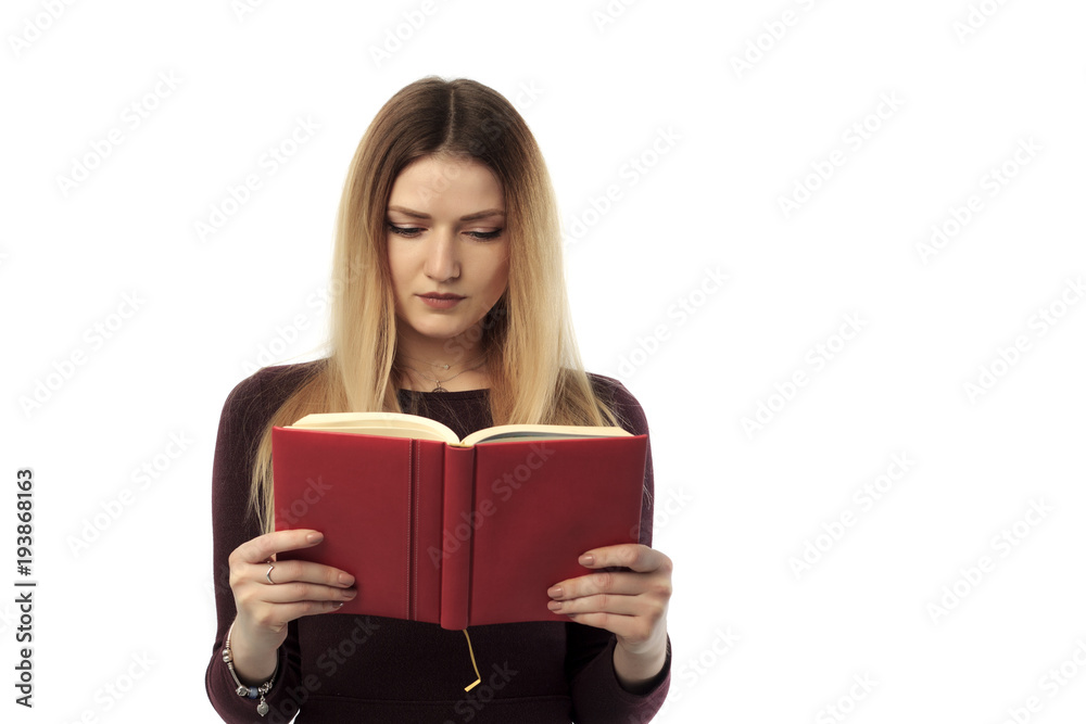 An isolated shot of a beautiful woman reading a book An isolated shot of a beautiful woman reading a book