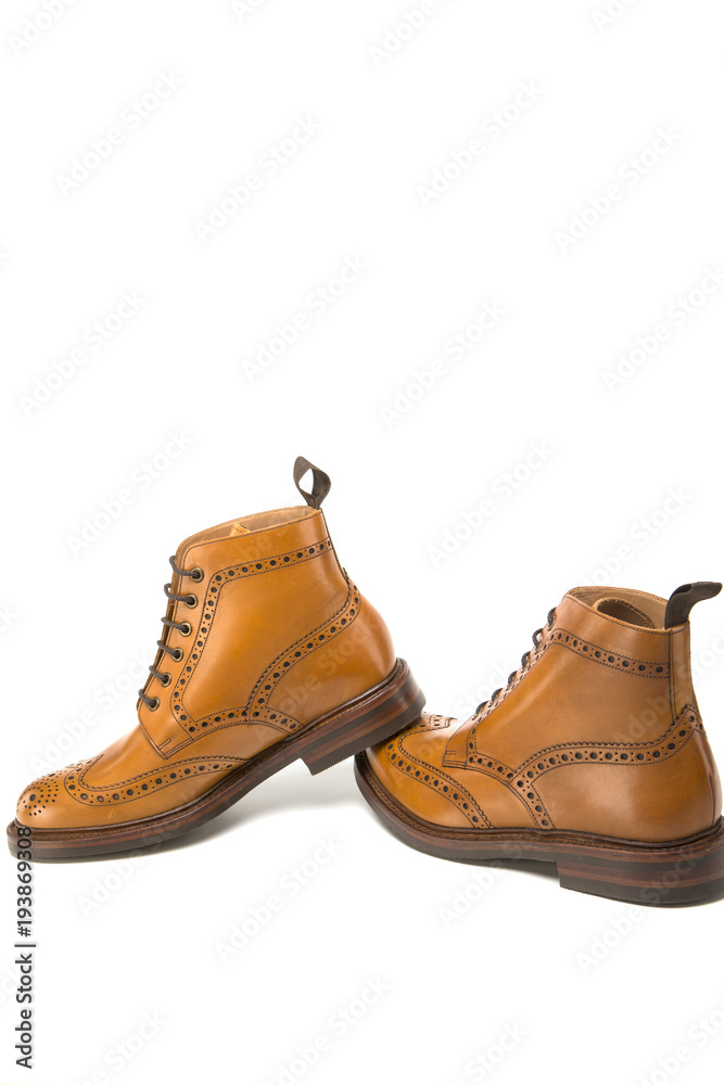 Shoes Concepts. Premium Tanned Brogue Derby Boots of Calf Leather with Rubber Sole. Isolated Over Pure White. Shoes Placed in Line. Shoes Concepts. Premium Tanned Brogue Derby Boots of Calf Leather with Rubber Sole. Isolated Over Pure White. Shoes Placed in Line.