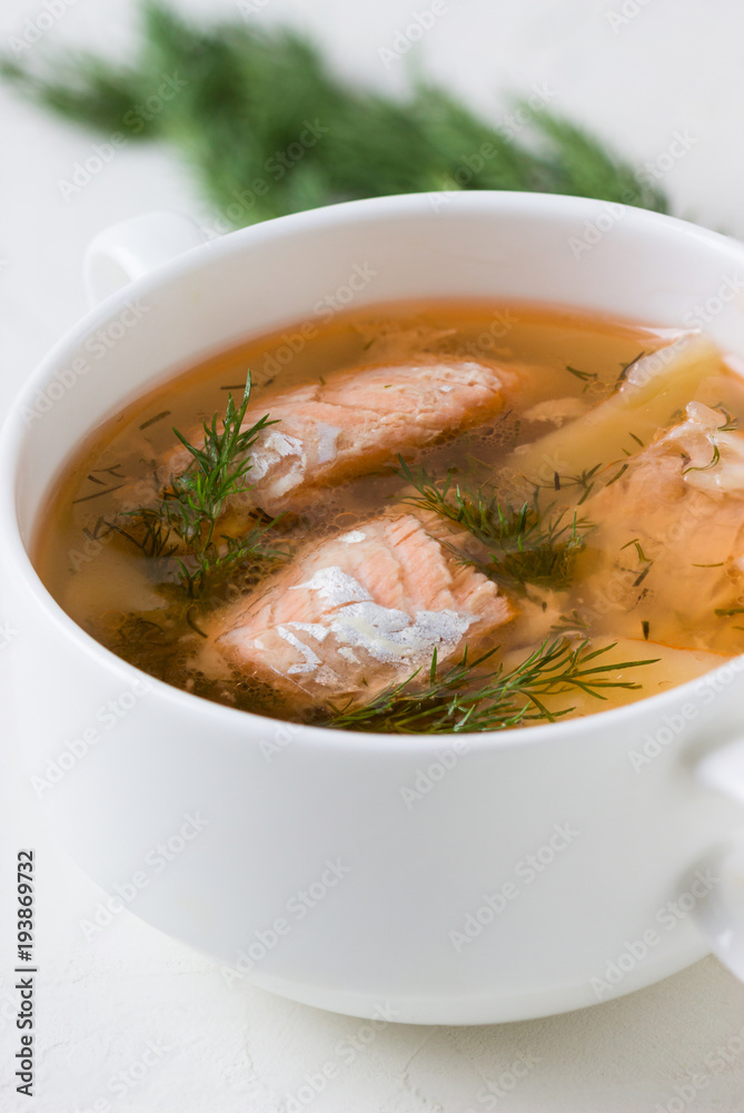 Salmon soup in a saucepan.
