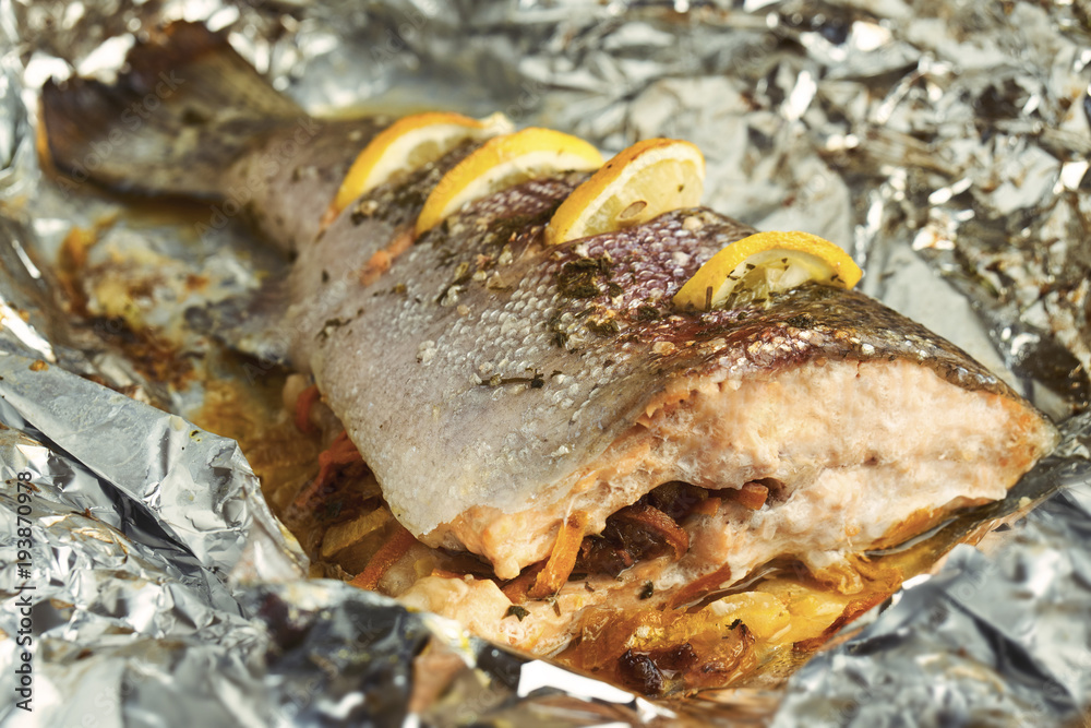 Grilled trout with slices of lemon Grilled trout with slices of lemon