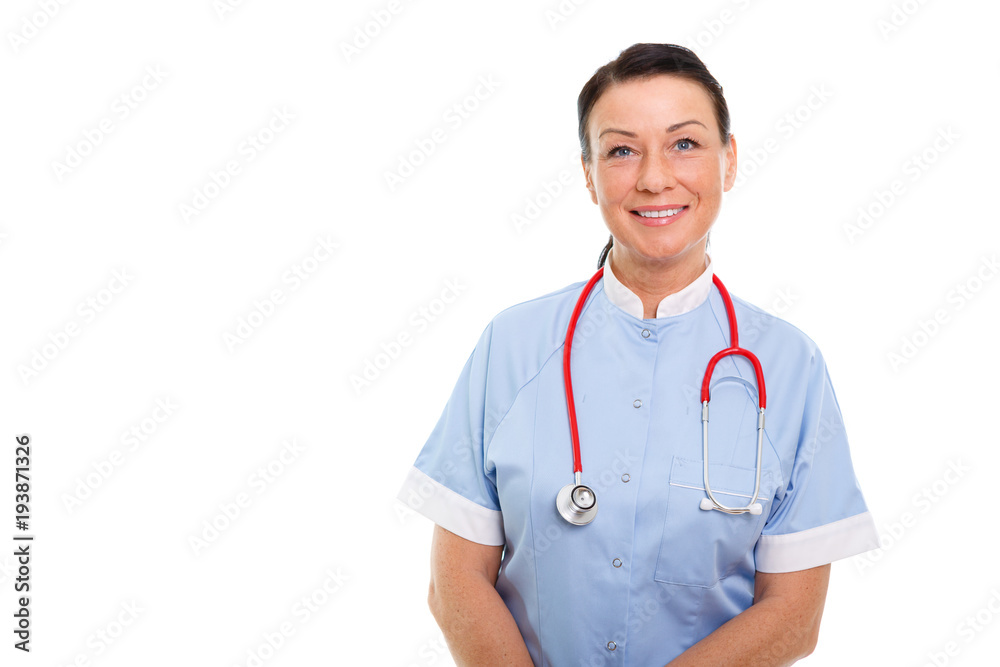 Portrait of Smiling brunette 35-40 years old woman in blue nurse uniform with Stethoscope on isolated white background. Health Care concept Portrait of Smiling brunette 35-40 years old woman in blue nurse uniform with Stethoscope on isolated white background. Health Care concept
