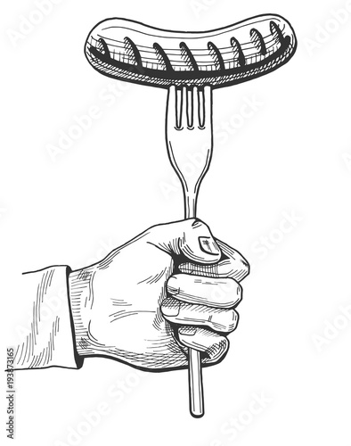 hand holding a sausage on fork