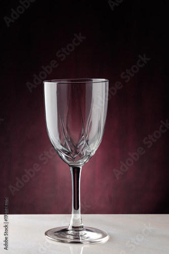 Empty cup on a white table on a dark background