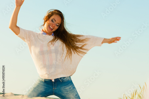 Young joyful girl on beach.