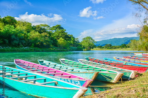 Slika na platnu Colorful canoes in Tamul river at Huasteca Potosina, Mexico