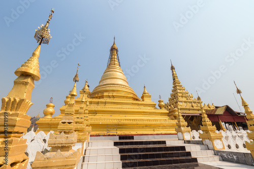 Gilded stupa at the Sandamuni Pagoda in Mandalay, Myanmar (Burma) on a sunny day.
