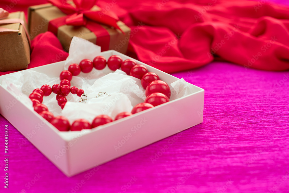 Bright necklace is Packed in a white box on a pink background. Bright necklace is Packed in a white box on a pink background.