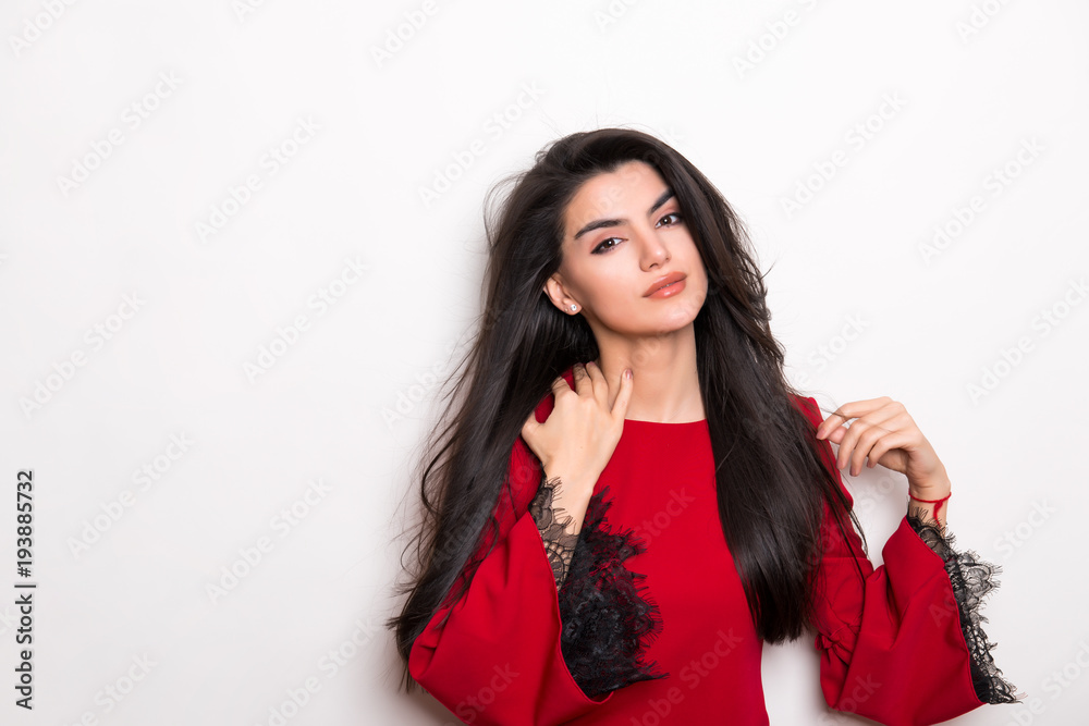 beautiful young woman with long black hair posing in red dress beautiful young woman with long black hair posing in red dress